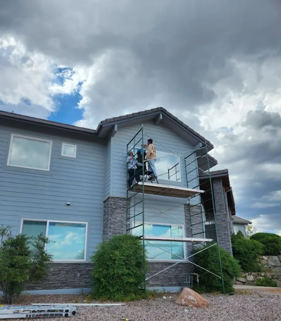 Tailored Windows and Doors completing an exterior window installation