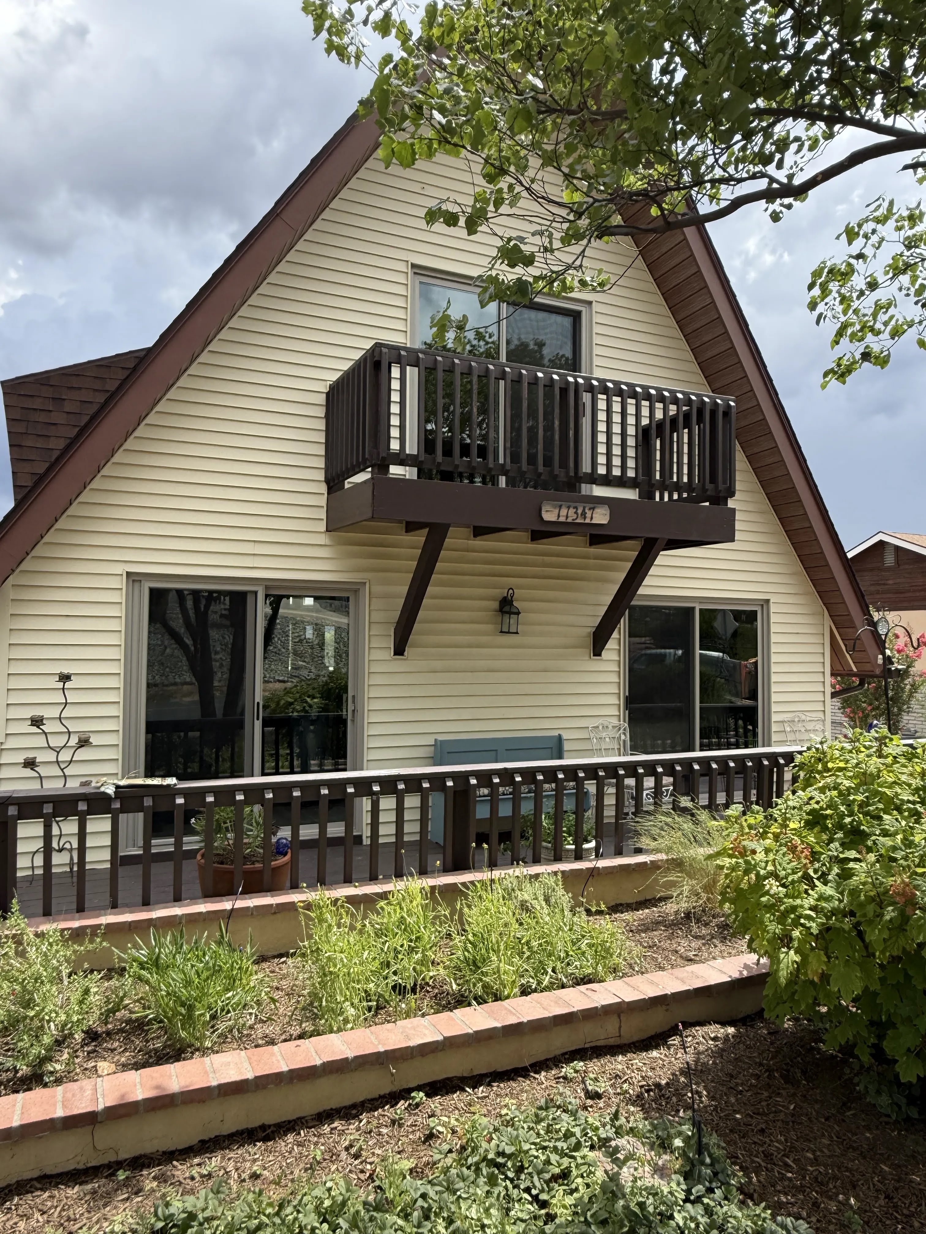 Completed exterior window and door project on an A-frame home
