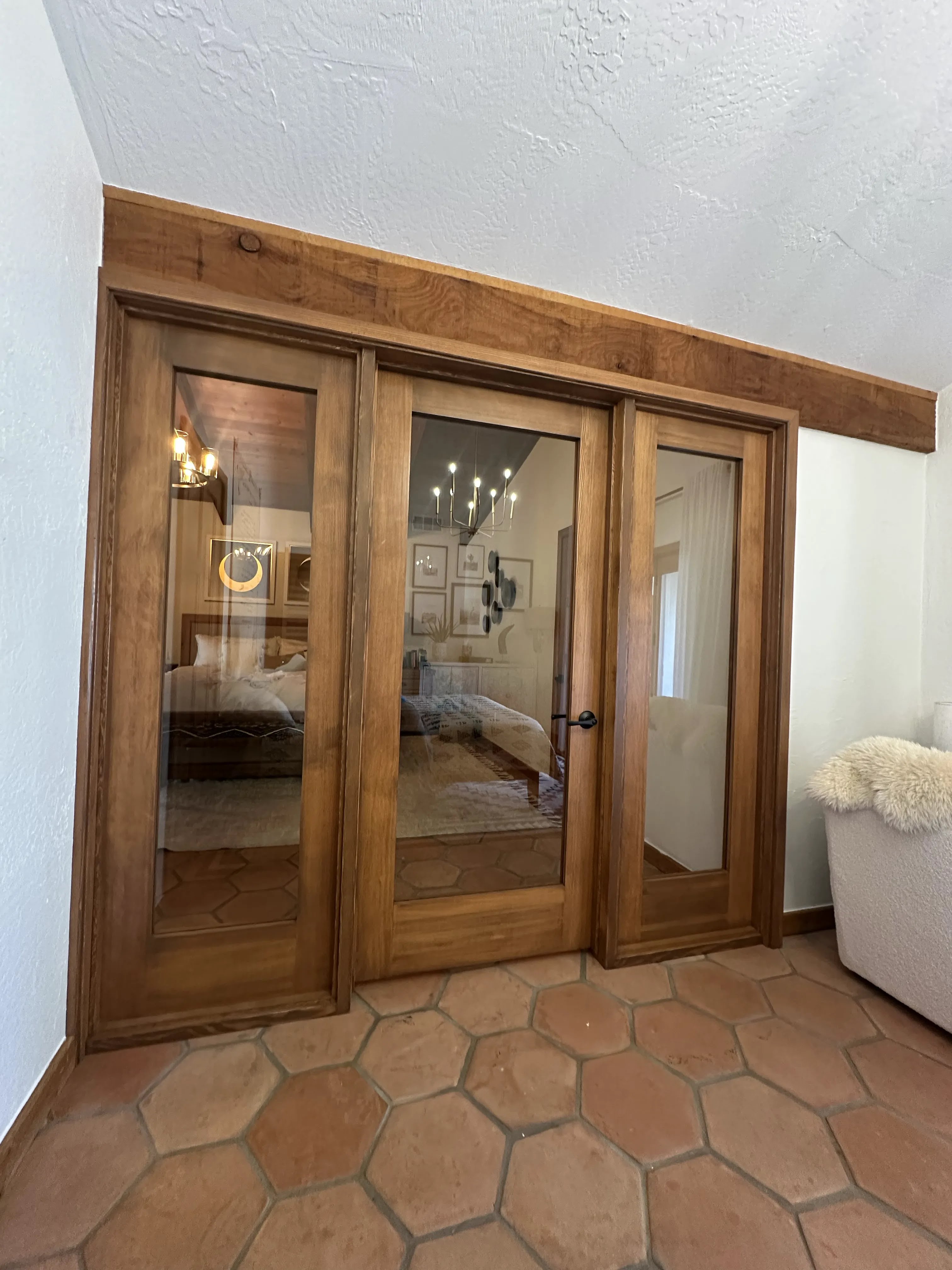 Custom wood-framed glass doors installed inside a home